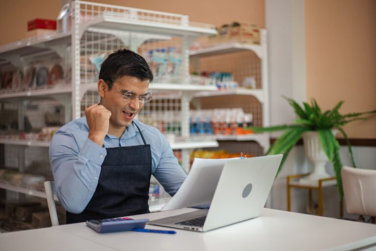 successful-businessman-have-good-news-from-computer-laptop